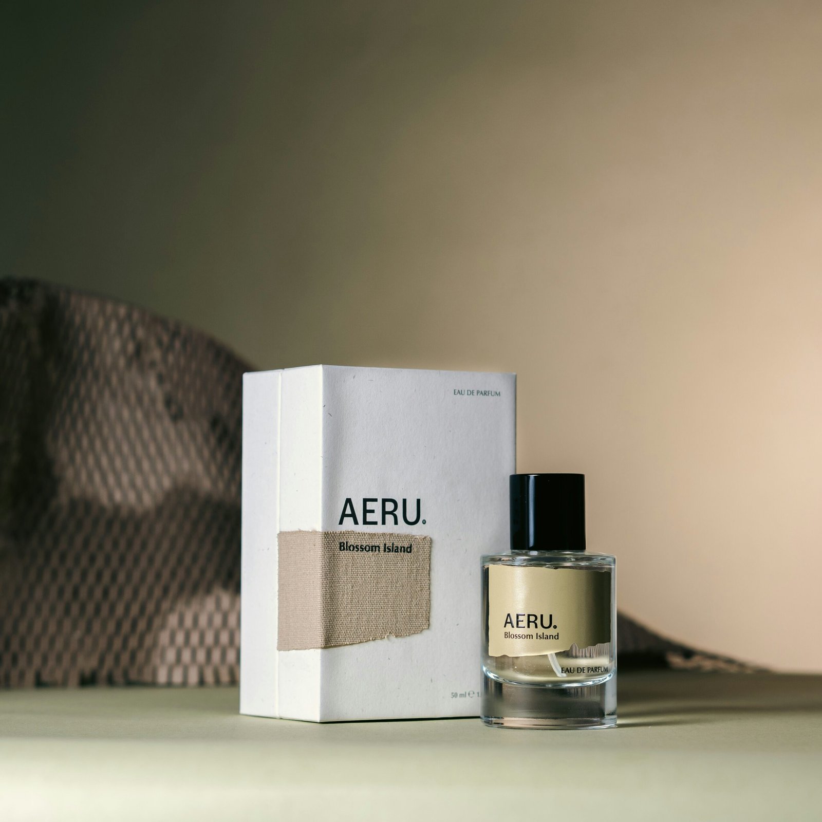 a bottle of aeru next to a box