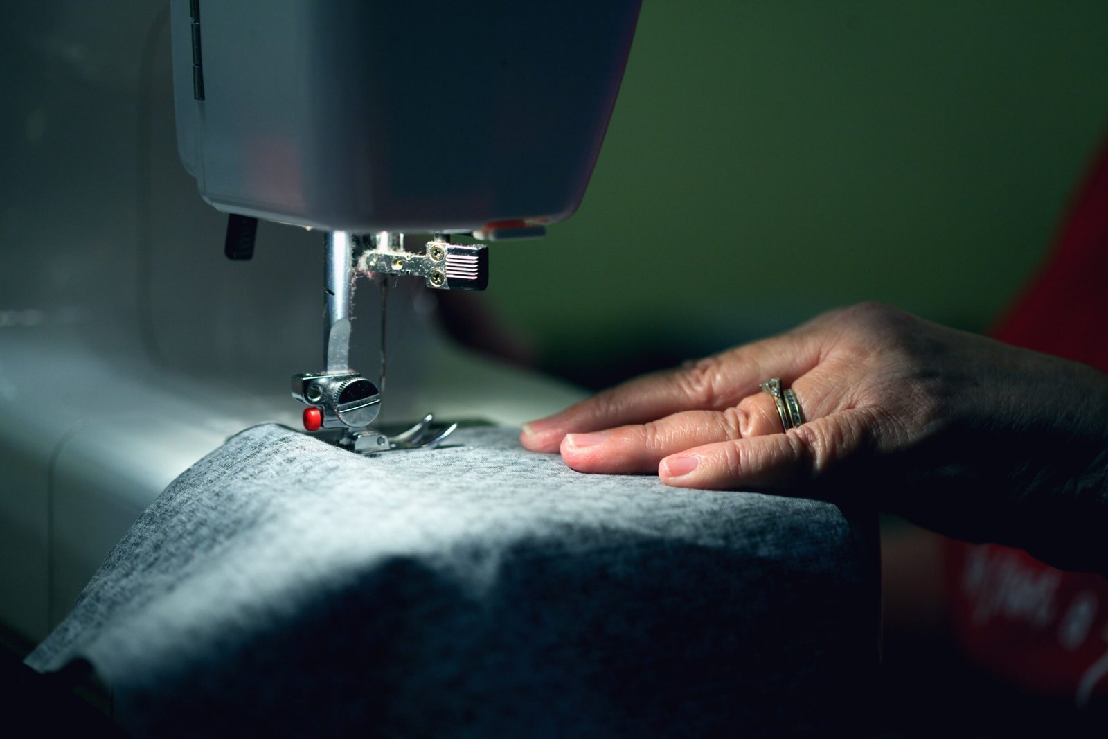 My seventy year old mother sewing a face mask. She has made thousands of cloth face masks since March, 2020. She gives them away to friends, coworkers, family, neighbors, and even complete strangers.